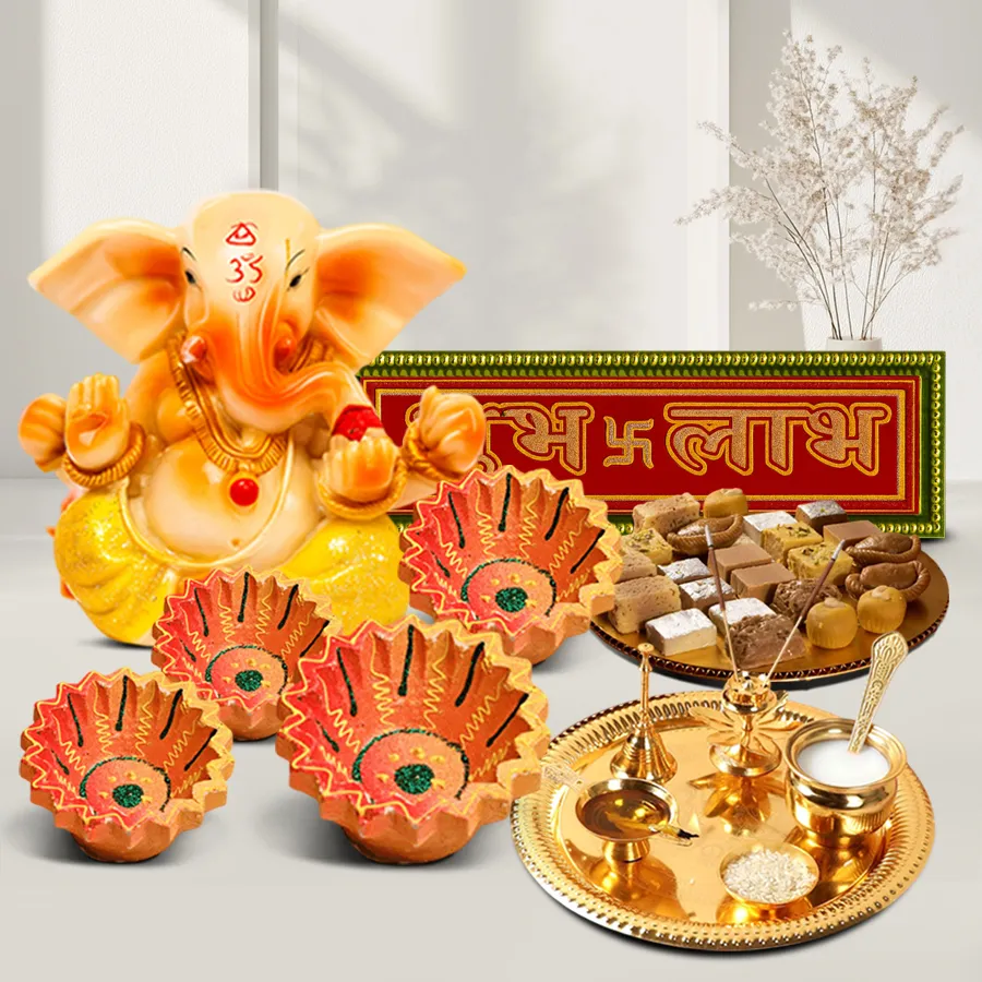 Luck and Prosperity Diwali Hamper featuring assorted sweets, a golden-plated pooja thali, designer clay diyas, a Vignesh Ganesh statue, and Subh Labh stickers.
