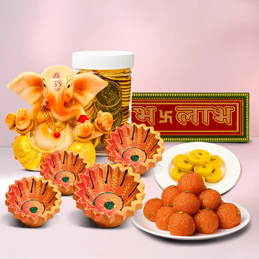 Radiant Festive Spirit Hamper containing Kesariya Peda, Motichoor Ladoo, gold coin-shaped chocolates, handcrafted clay diyas, and Subh Labh stickers, all beautifully arranged for Diwali celebration.