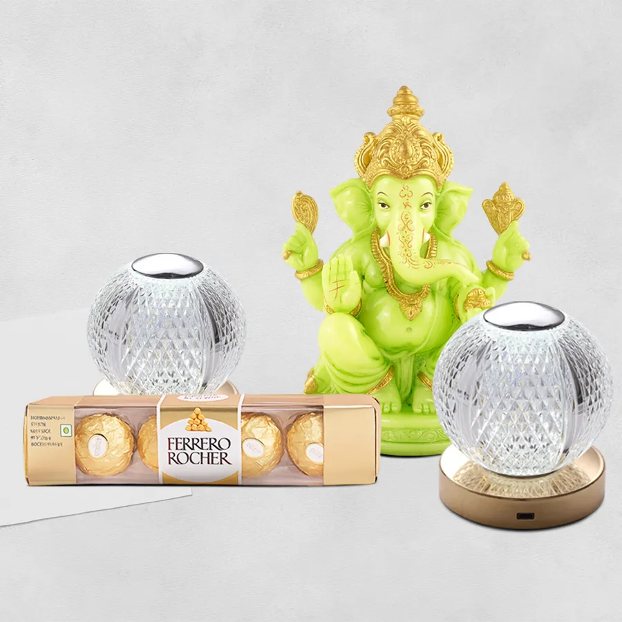 Enchanting Ganesh idol surrounded by a gift hamper featuring LED lights and Ferrero Rocher chocolates