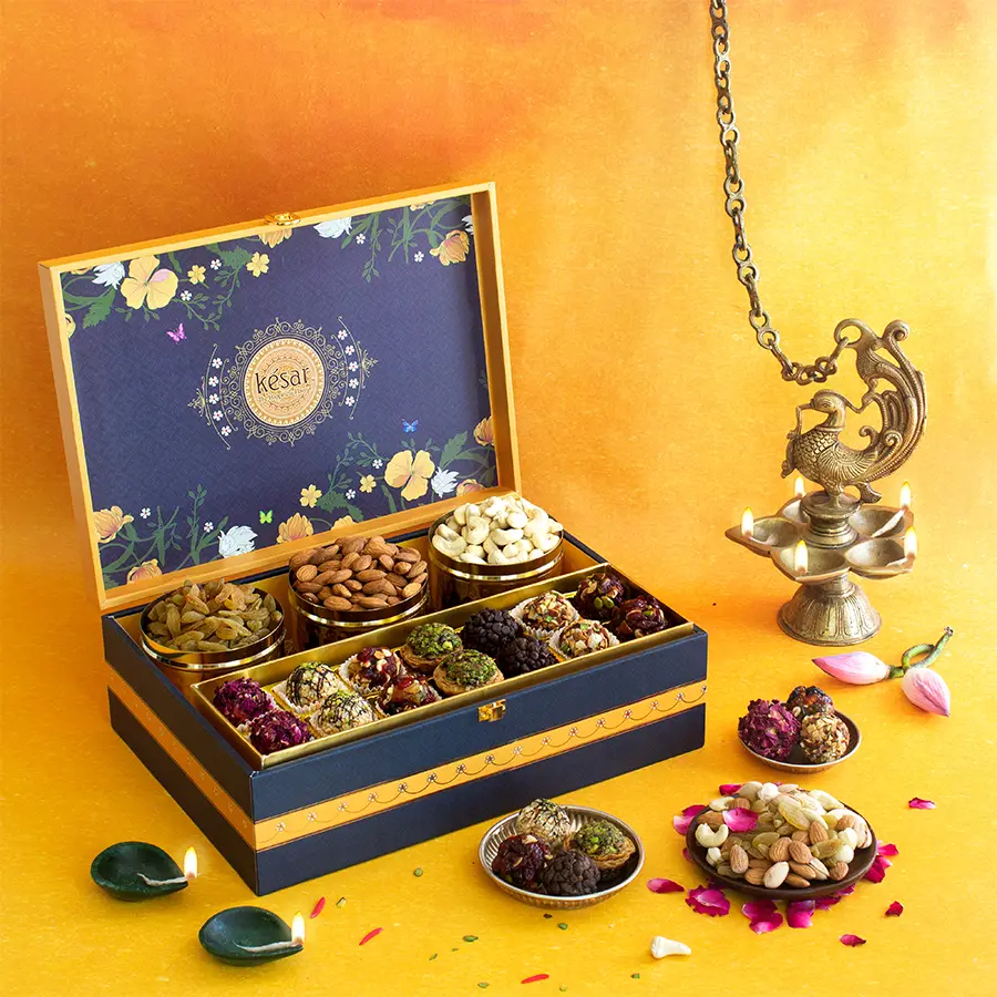 Sweet Delight Diwali Gift Box featuring 14 premium laddoos, crunchy cashews, big almonds, and sweet raisins in a vibrant yellow flower box.