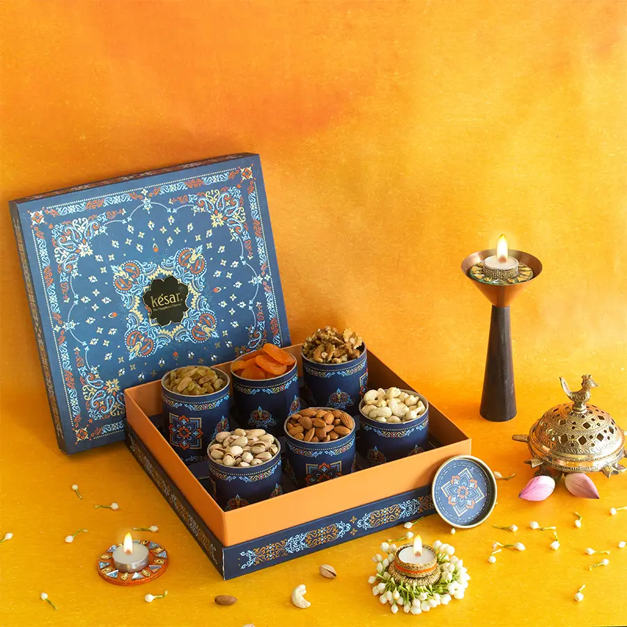 Premium Assorted Dryfruit Gift Box for Diwali containing walnuts, almonds, cashews, raisins, pistachios, and apricots in festive packaging.
