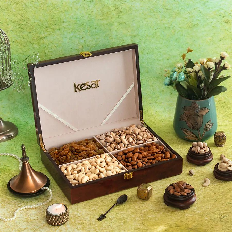 Wooden lacquer gift box filled with assorted premium nuts including cashews, almonds, pistachios, and raisins, featuring an elegant mosaic design, perfect for Diwali gifting.