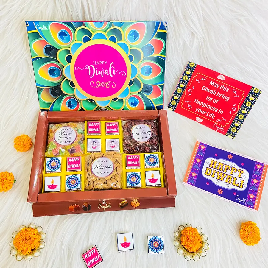 Blissful Diwali Culinary Surprise Box featuring assorted chocolates, premium almonds, mixed fruits, cranberries, and a Diwali-themed design with a greeting card.