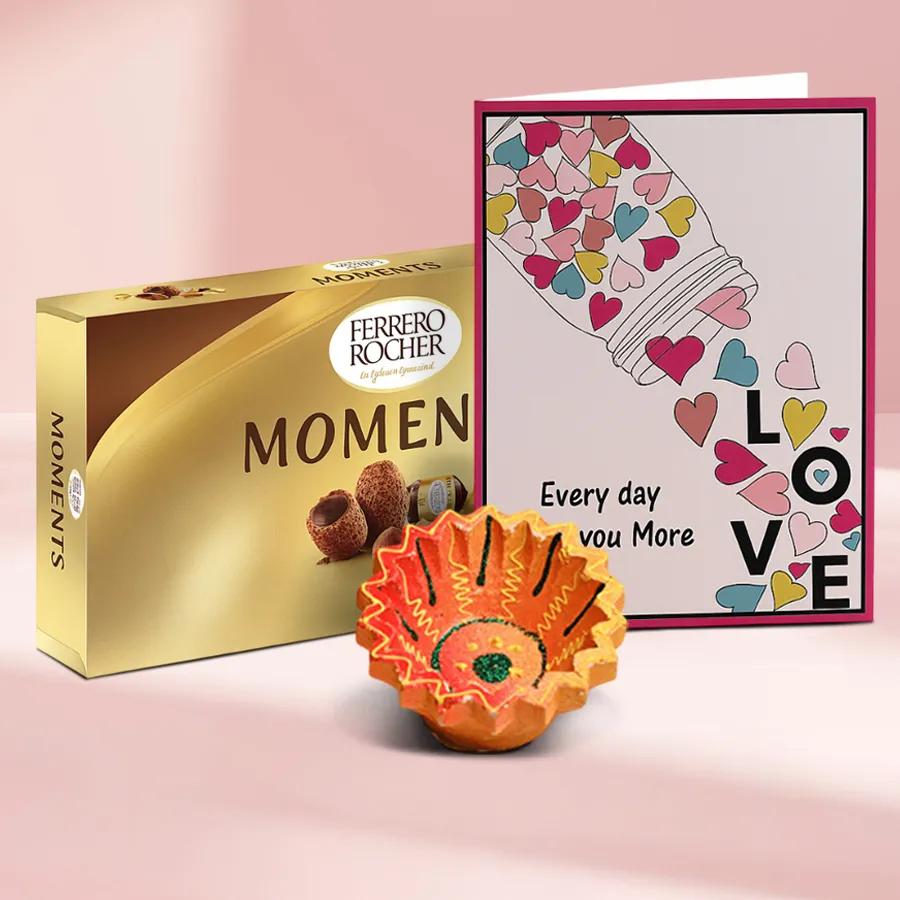 Light Up Diwali Chocolates N Diya Magic hamper featuring a crafted Diya, 12 Ferrero Rocher chocolates, and a message card.