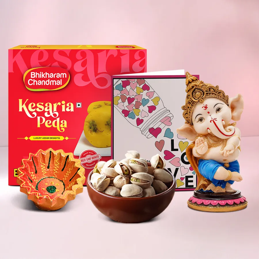 Diya, Peda, Ganesha Gift Set featuring a crafted diya, Kesaria Peda, pistachios, and a Lord Ganesha showpiece