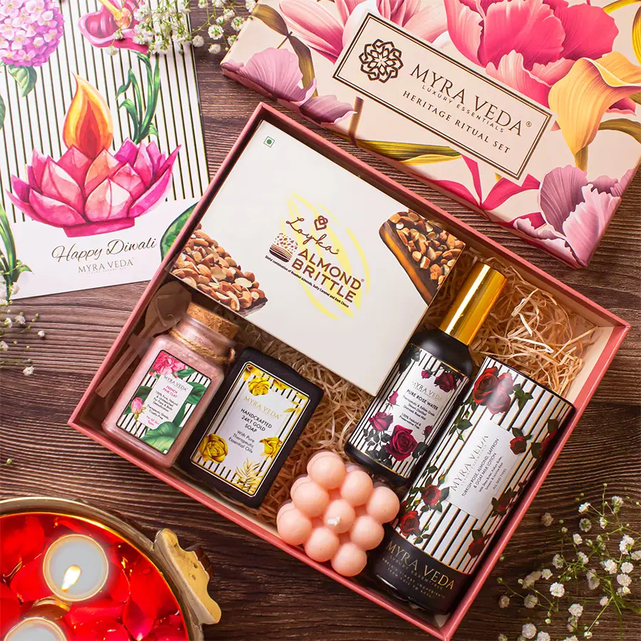 Unwind and Relax Hamper featuring Almond Brittle Chocolate, 24Kt Gold Soap, Almond Saffron Goat Milk Lotion, Pure Rose Water, Organic Soya Wax Candle, fresh Turkish Rose, and Organic Clay.