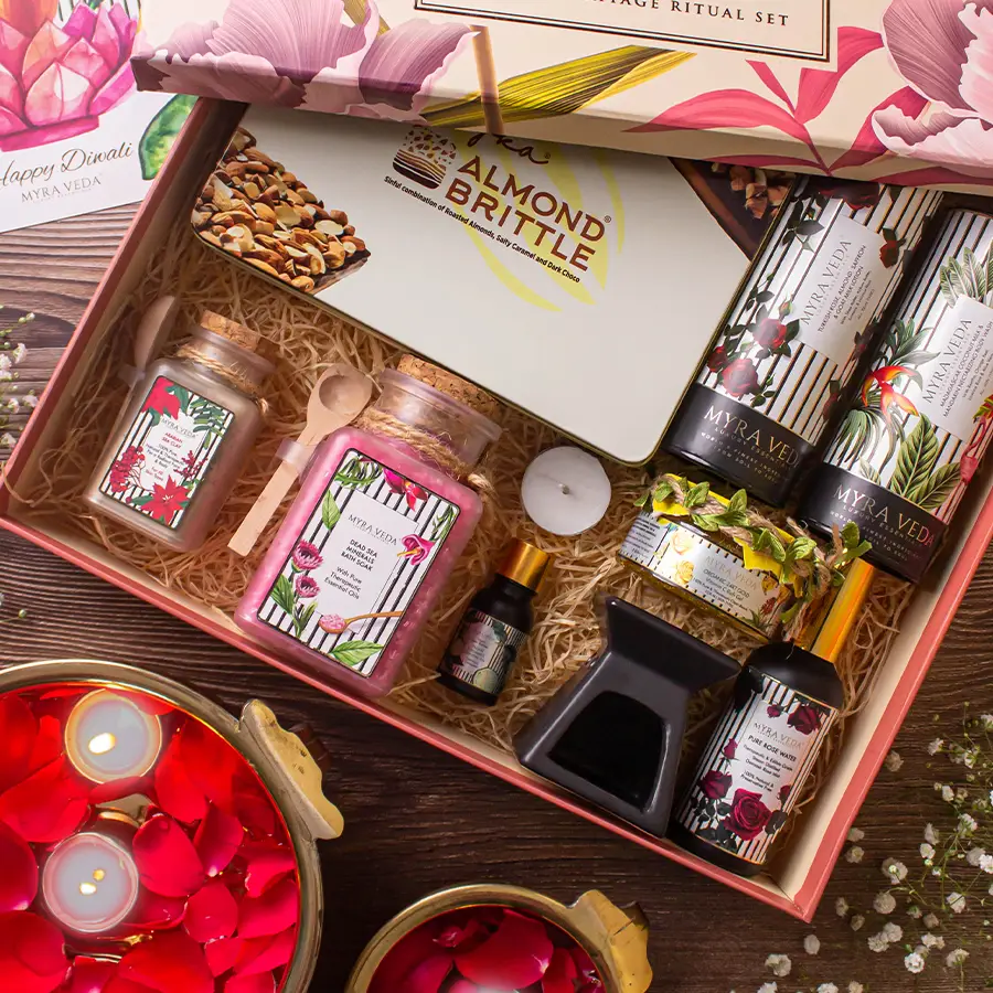 Exquisite Self Care Bundle featuring bath soaks, rose water, organic soy candle, bergamot diffuser, luxurious lotions, 24K gold gel, almond brittle chocolate, and coconut milk body wash.