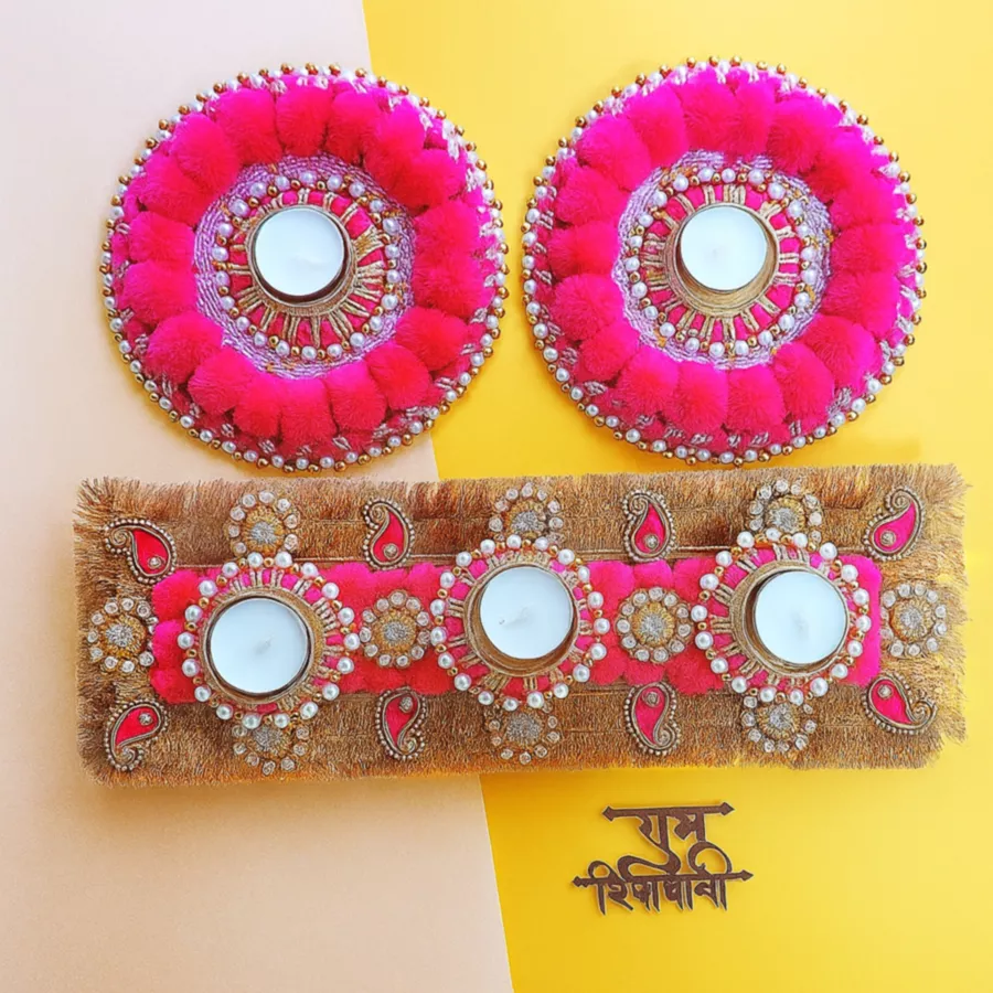 Set of 5 designer T-light candles in elegant holders with unique designs, arranged aesthetically on a table