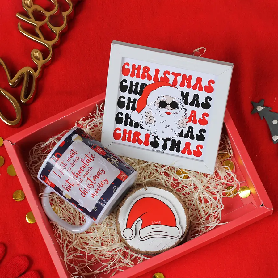 Holiday Highlights Gifts Combo featuring a chic wall frame, a festive mug, and a unique sliced log hanging.