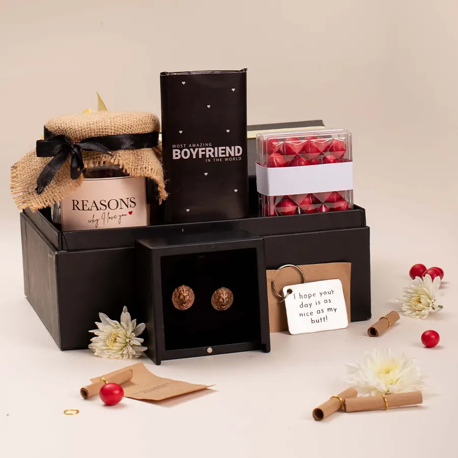 Unforgettable Surprises Hamper for Boyfriend featuring chocolates, cherry dragees, reasons I love you jar, keychain, and lion cufflinks in a black signature box