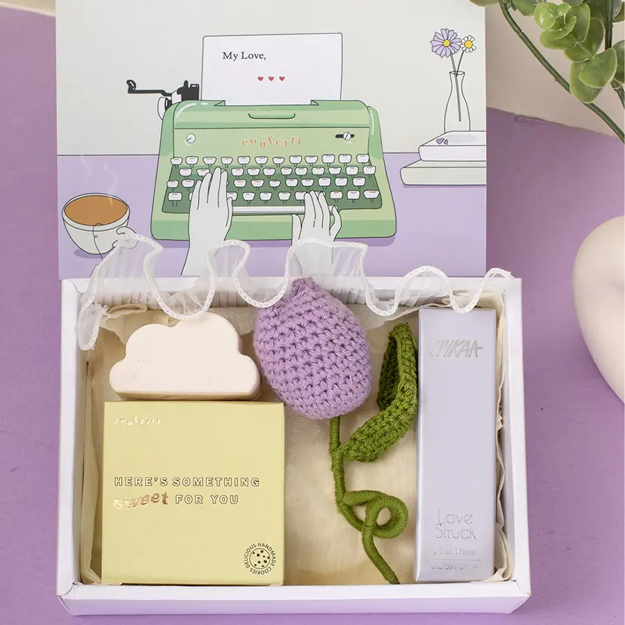 Fragrance N Floral Charm Gift Hamper featuring Nykaa Love Struck Perfume, Cloud Soap, handmade nut cookies, Tulip Crochet Flower, and an elegant Slider Box.