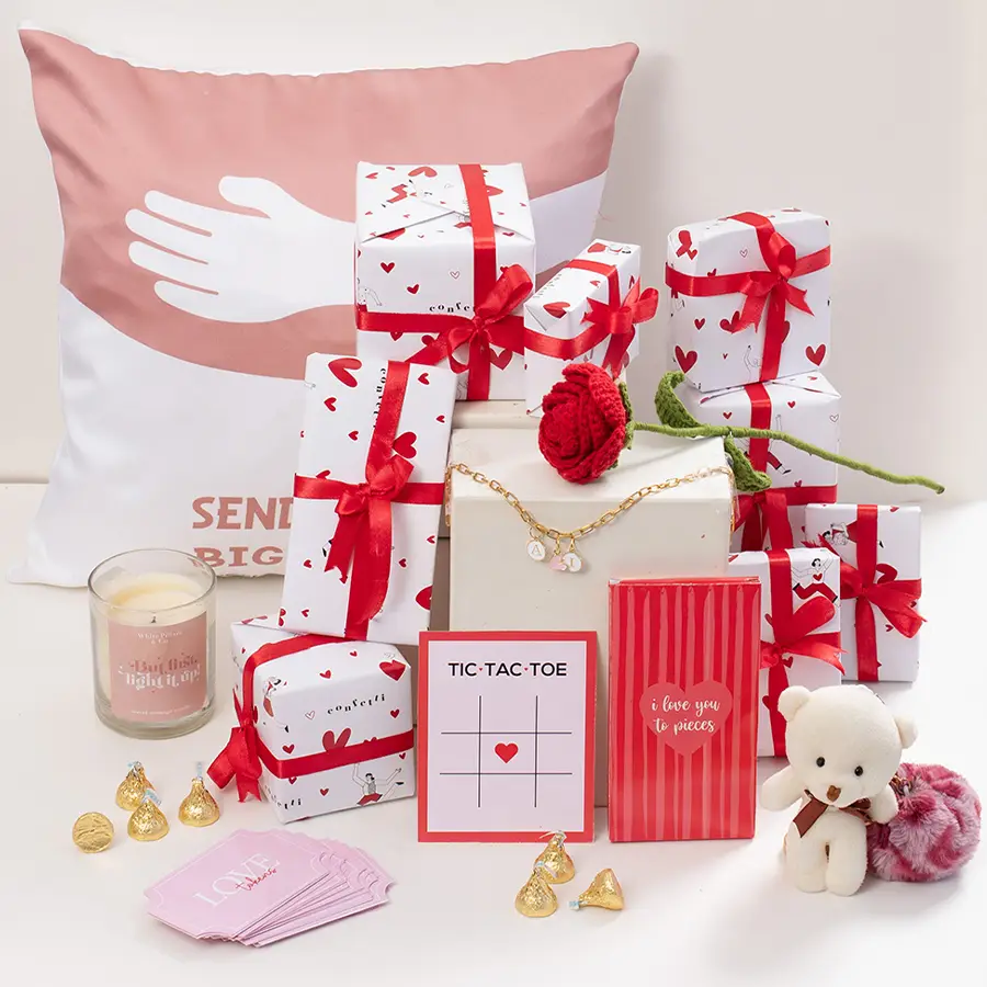 7 Days Valentine Surprise Hamper featuring a Crochet Rose, I Love You Candle, chocolates, Teddy Keychain, Love Tokens, Hug Cushion, Tic Tac Toe Kisses, and Initial Bracelet, beautifully packed in a Love Wrapping Paper Box