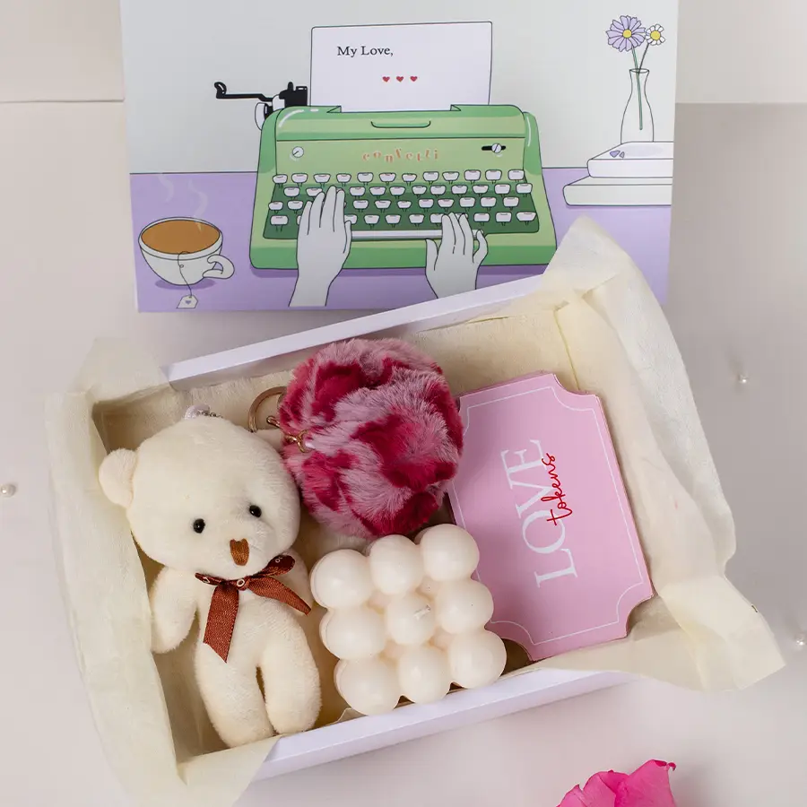 Ultimate Love N Affection Gift Hamper with teddy keychain, bubble candle, love tokens, and slider box arranged beautifully