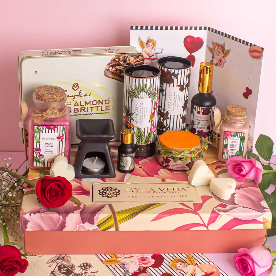 Ultimate Myra Veda Self-Care Gift Set featuring essential oils, a diffuser, chocolates, lotions, body washes, and a bath soak, arranged beautifully with a handwritten card.