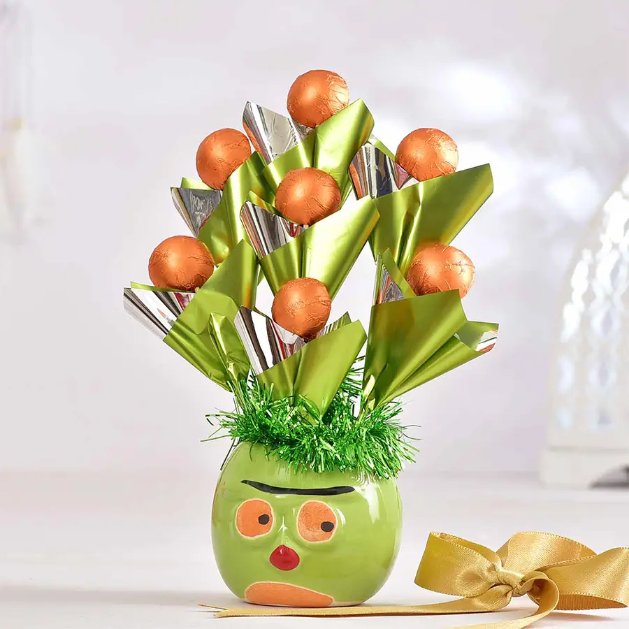 Green ceramic pot filled with 7 handmade chocolates and a Valentine's Day card.