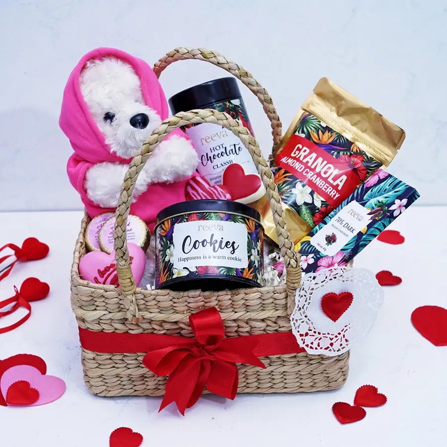 Irresistible Valentine's Chocolates Gift Hamper featuring teddy bear, chocolate bar, lollipops, cookie tin, and granola