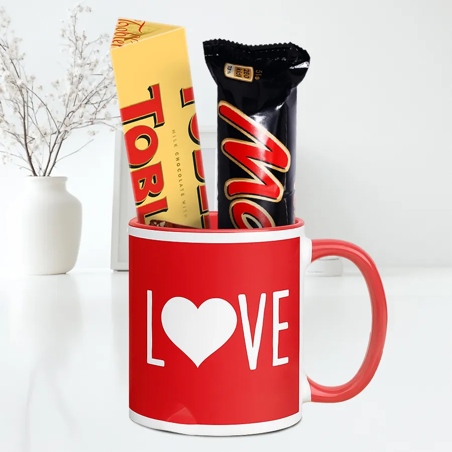 Ultimate Choco Treat N Valentine Mug Combo featuring a love-printed mug, Toblerone chocolate, and Mars Bar.