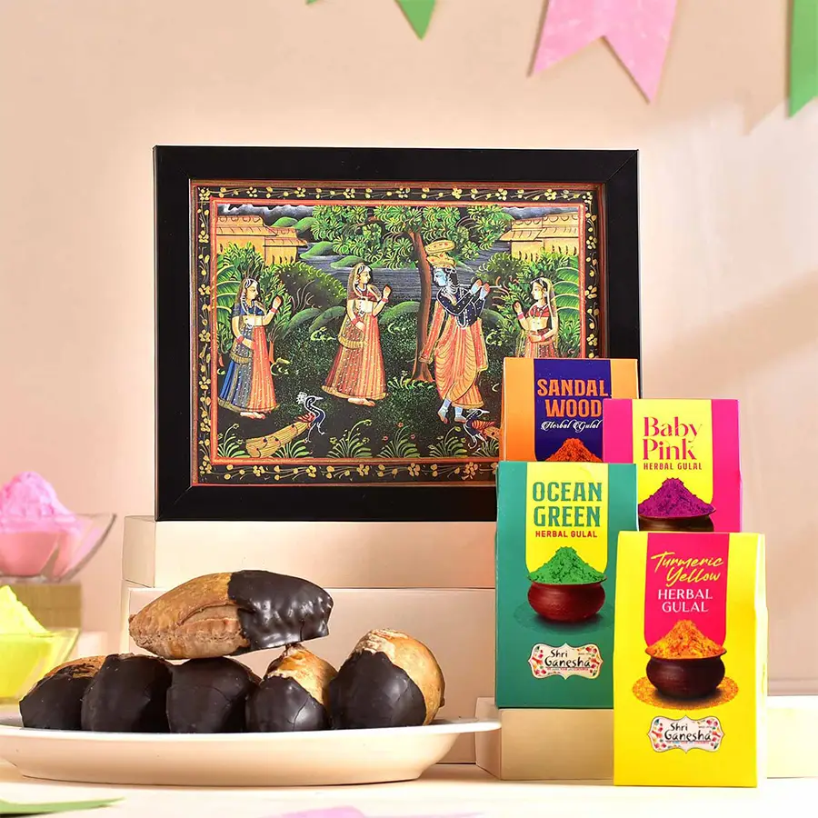 Radiant Holi Vibes Gifts Hamper featuring an Angelic Radha-Krishna desktop painting, natural herbal gulal set in vibrant colors, and chocolate dipped gujiya