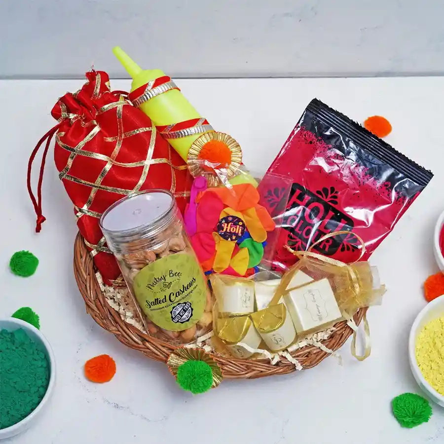 Holi Cheers Hamper featuring Strawberry Crisp Logs, assorted chocolates, salted cashews, a colorful pichkari, balloons, and vibrant Holi colors in a festive basket