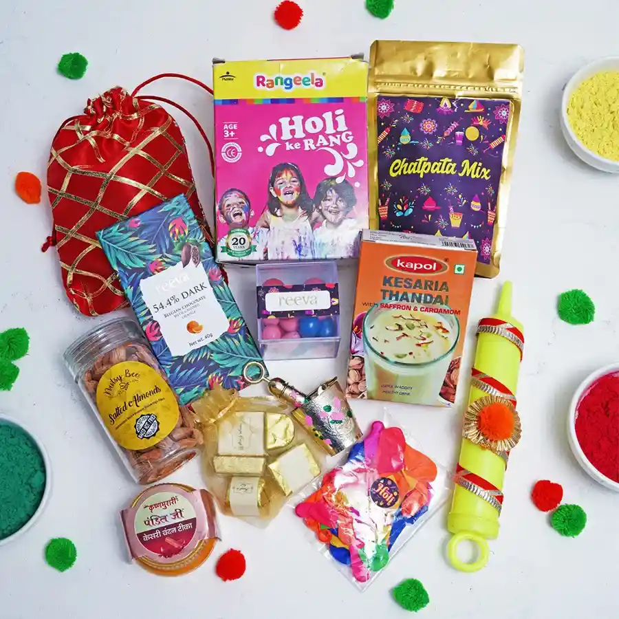 A vibrant gift hamper filled with colorful Holi powders, pichkaris, balloons, Chatpata Mix, Belgian chocolates, dragees, salted almonds, Kesar Thandai, and Laddu Gopal Balti.