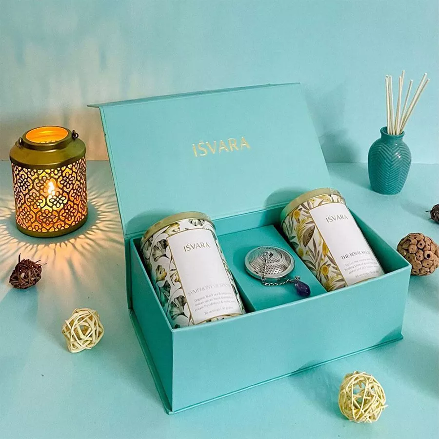 Ultimate Tea Ensemble Gift Set featuring bold spice-infused black tea, delicate green tea blend with rose petals, and an amethyst gem tea filter.