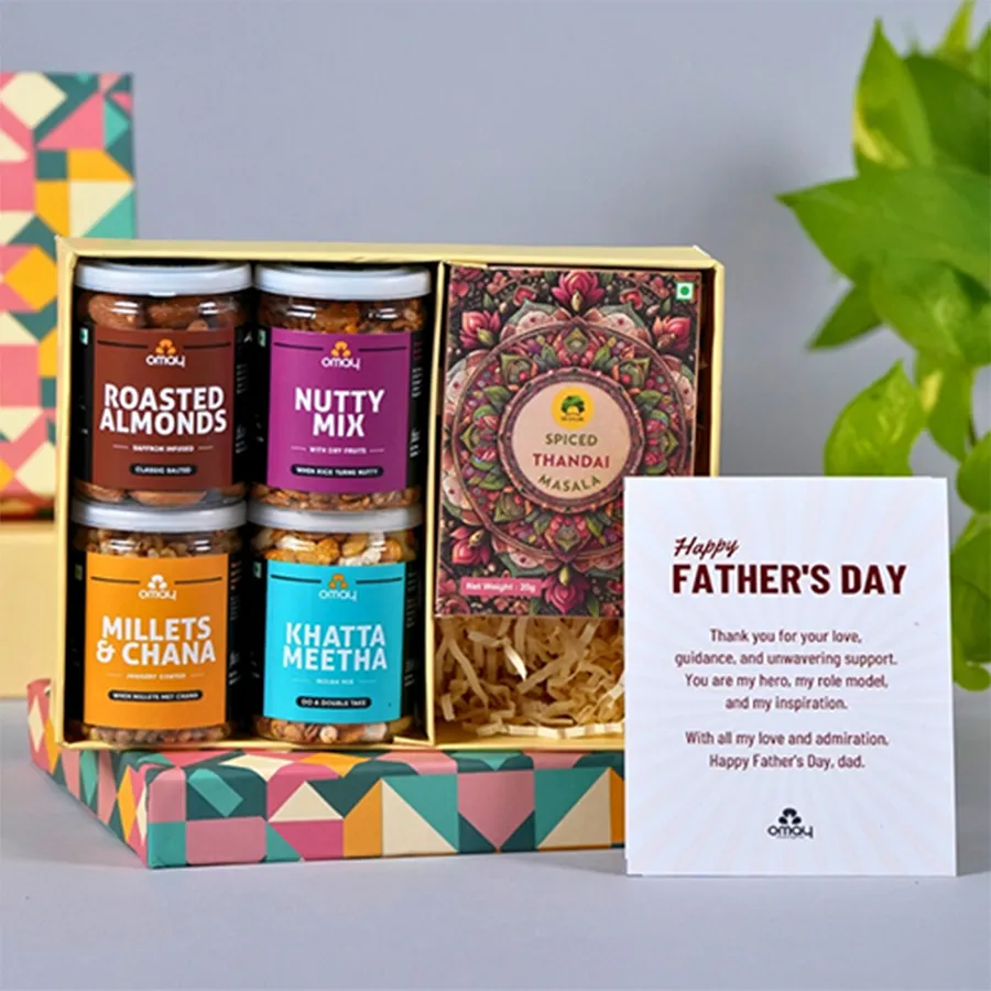Father's Day Feast Gift Box with assorted snacks including roasted almonds, khatta meetha, nutty mix, millets and chana, and a Gulabs instant Thandai, accompanied by a Happy Father's Day card.