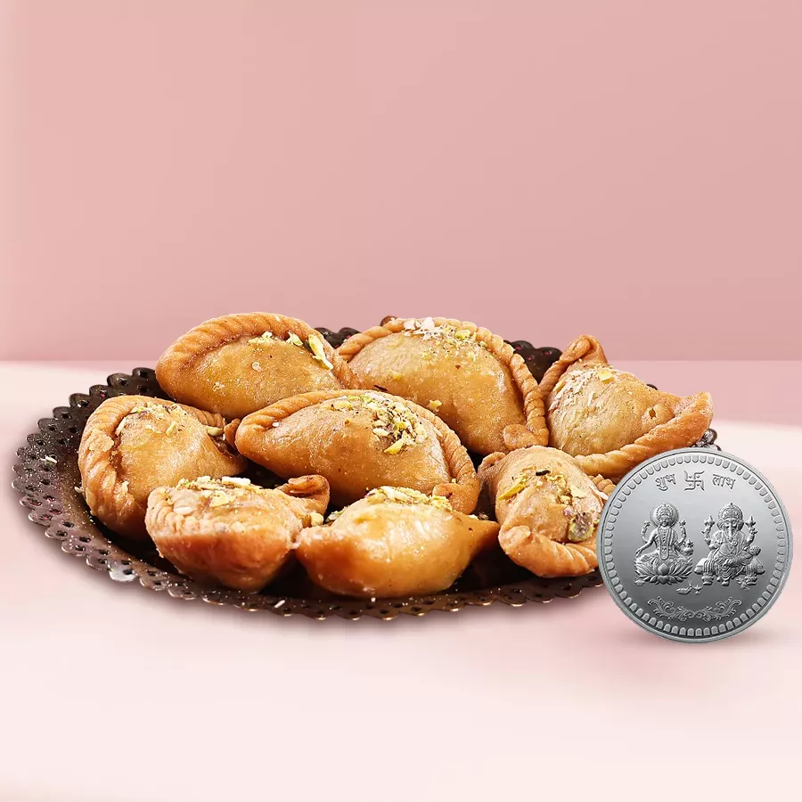 Haldirams Khowa Puri with a silver-plated Ganesh and Laxmi coin for Diwali celebrations