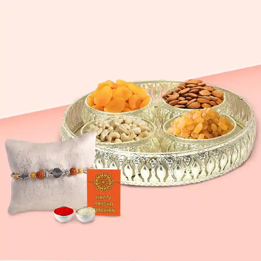 Auspicious Festive Rakhi set featuring four silver-plated bowls filled with mixed dry fruits and a decorative Rakhi.