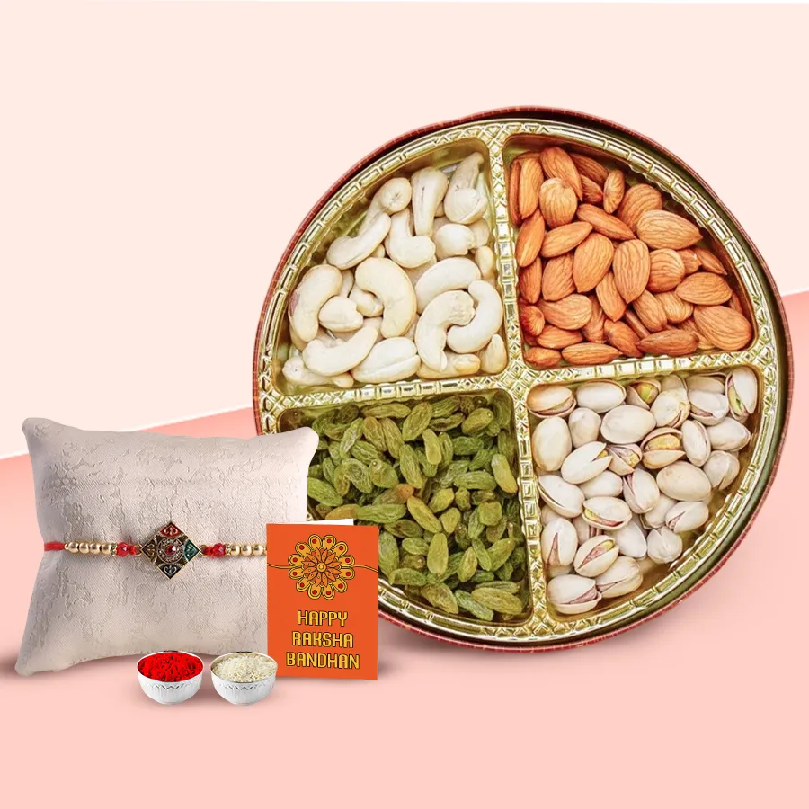 Assorted dry fruits with a decorative Rakhi, Roli, Tilak, and Chawal in an elegant packaging for Raksha Bandhan celebration