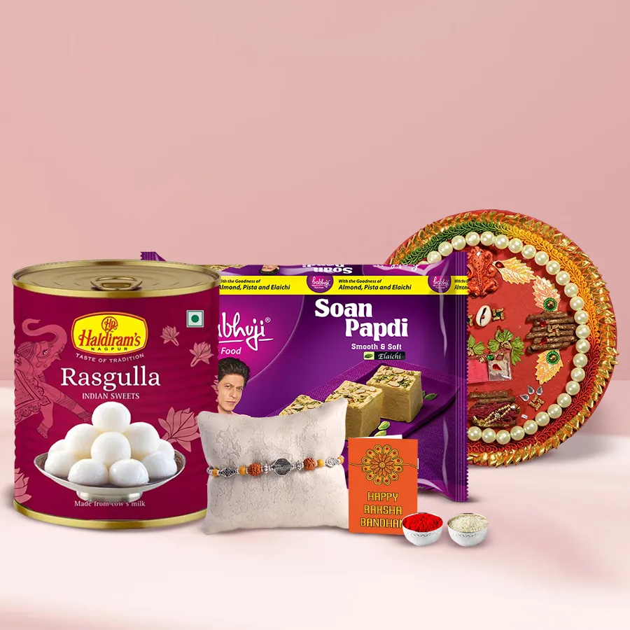 Designer Rakhi Thali with Rasgulla, Haldiram’s Soan Papdi, Rakhi, roli, tilak, and chawal