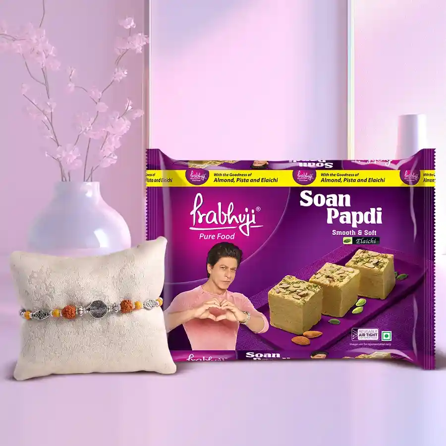 Haldiram Soan Papdi 200g pack with a free Rakhi, traditional Roli, Tilak, and Chawal for Raksha Bandhan celebration