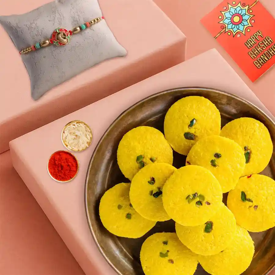 Haldiram Kesaria Pedas bouquet with Rakhi, Roli Tika, and Chawal for Rakshabandhan celebration