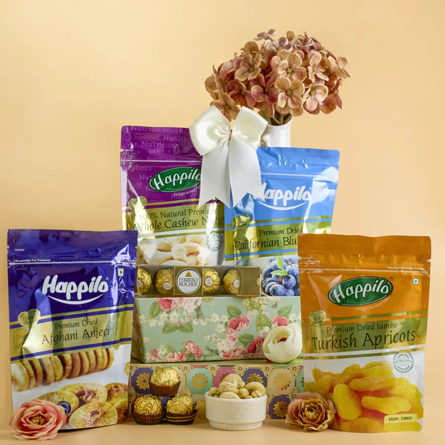 Deluxe Gourmet Treats Gift Basket featuring Turkish apricots, Californian blueberries, Afghani Anjeer, and Ferrero Rocher chocolates arranged in a reusable designer basket
