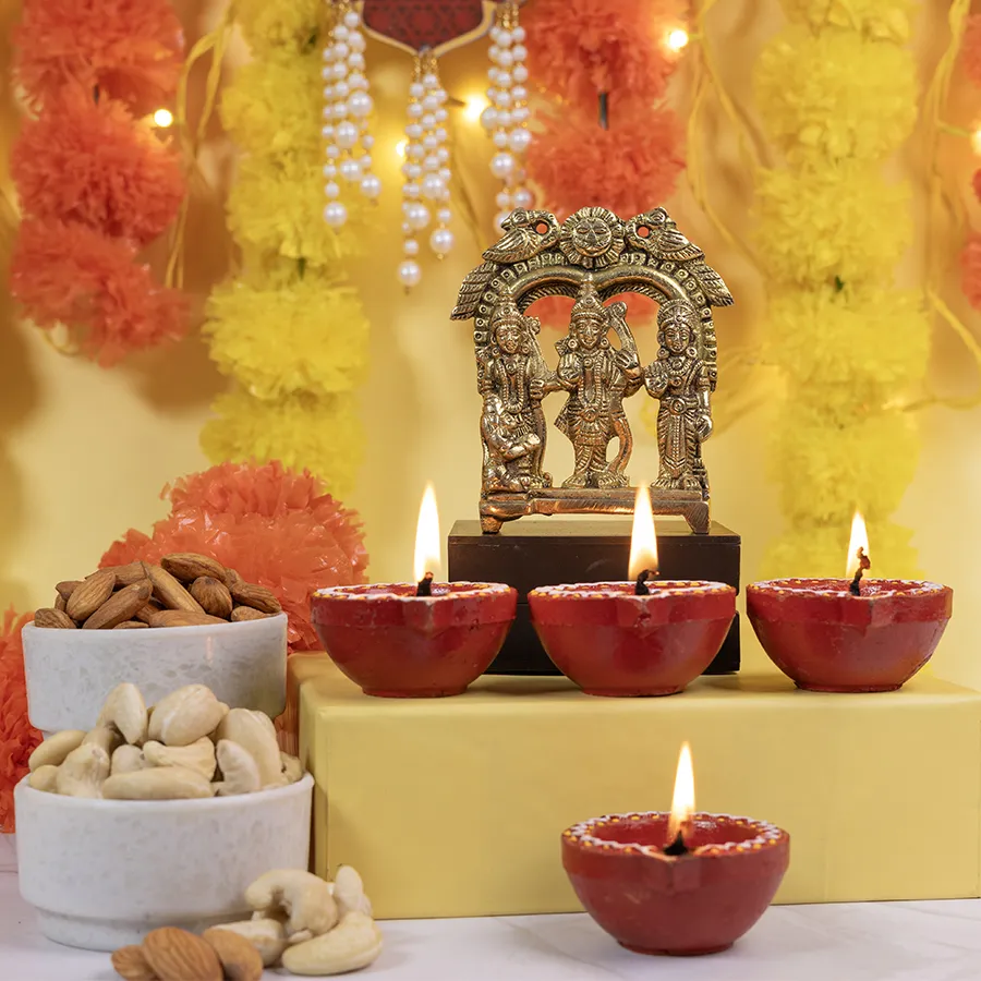 Graceful Brass Ram Darbar Idol with four mud diyas and bowls of almonds and cashews