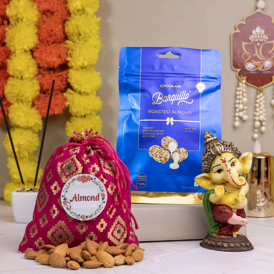 Sweet N Spiritual Gift Set featuring a Dancing Ganesh showpiece, Almond Potli, and Barquillo Roasted Almond Coated Chocolate