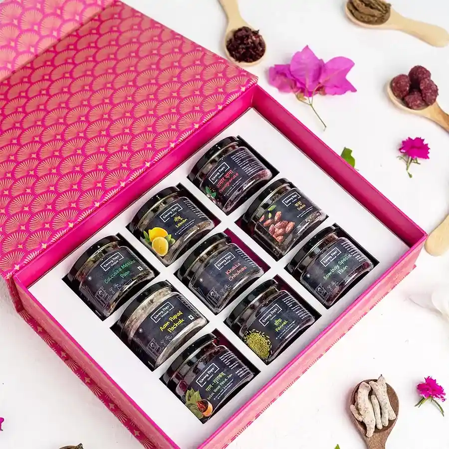 Colorful jars filled with assorted handmade mukhwas mouth fresheners, showcasing Paan Gulkand, Anardana, and Sweet Saunf, presented in an attractive gift set.