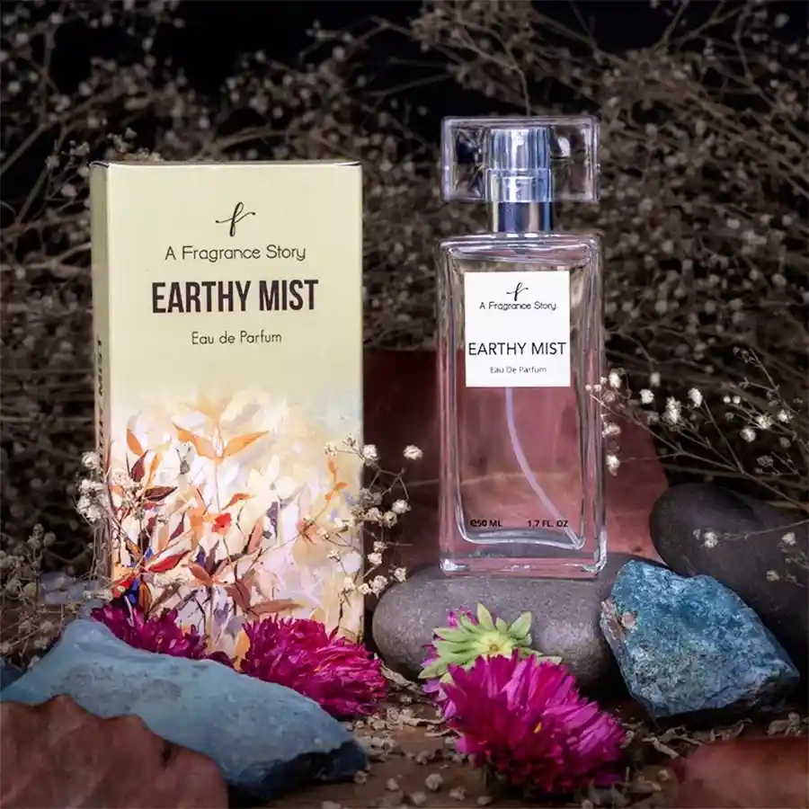 Fresh N Woody Earthy Mist Essence bottle with a natural background showcasing its earthy and floral ingredients