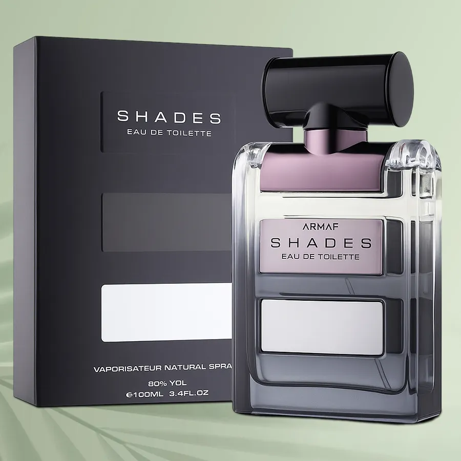 Bottle of Armaf Shades Perfume for Men surrounded by elegant packaging, showcasing its captivating design and branding.