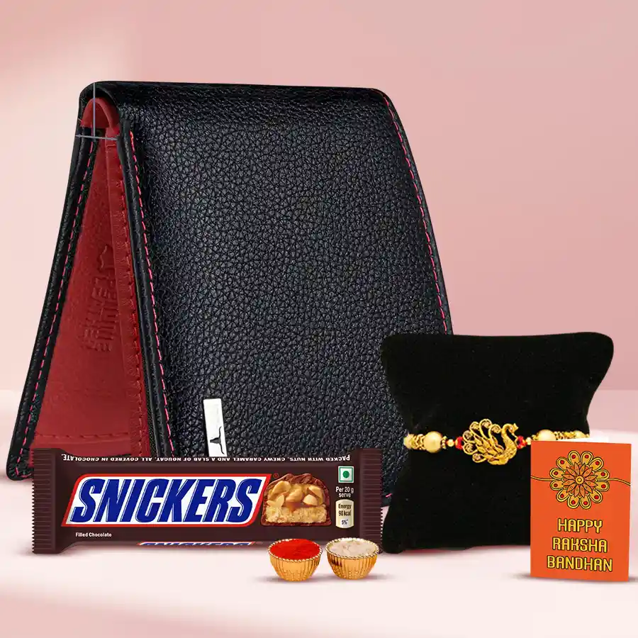 Gold plated Rakhi gift set featuring a gold-plated Rakhi, a leather wallet, and a Snickers chocolate bar, along with Roli Tilak, Chawal, and a personalized Rakhi card.
