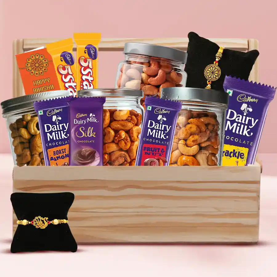 Classy Twin Golden Rakhi Set with flavored cashews and Cadbury chocolates in a wooden basket
