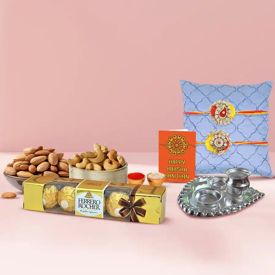 Designer Zardosi Rakhi Lumba set with puja thali, dry fruits, Ferrero Rocher chocolates, and a personalized Rakhi card in a reusable gift box.