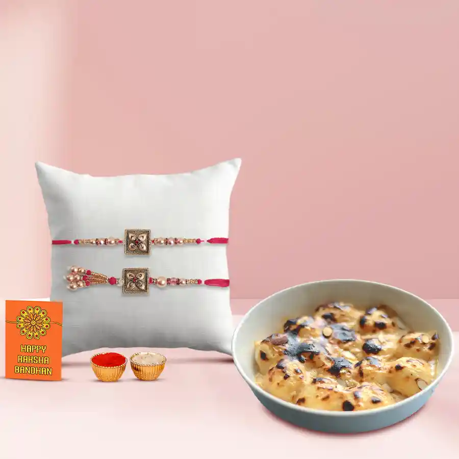 Delicious Rasgulla gift pack with Bhaiya-Bhabhi Rakhi set, Rakhi message card, and Roli Chawal tika.