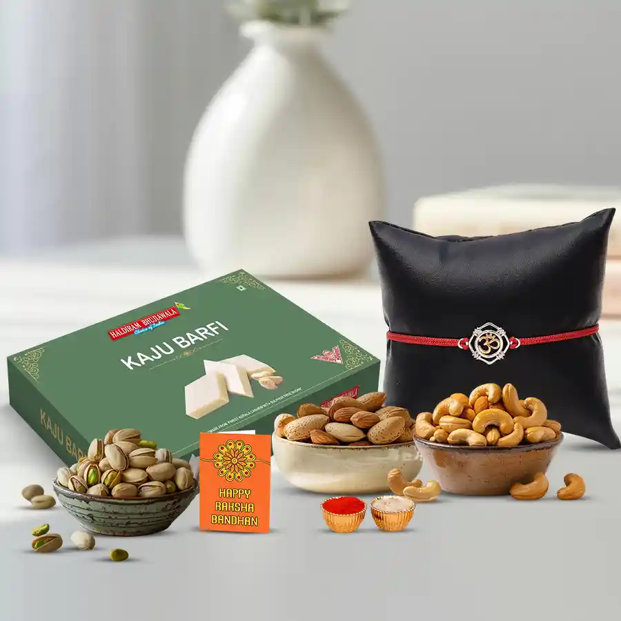 Classy Metal OM Rakhi with Haldiram Kaju Barfi and Dry Fruits in decorative packaging