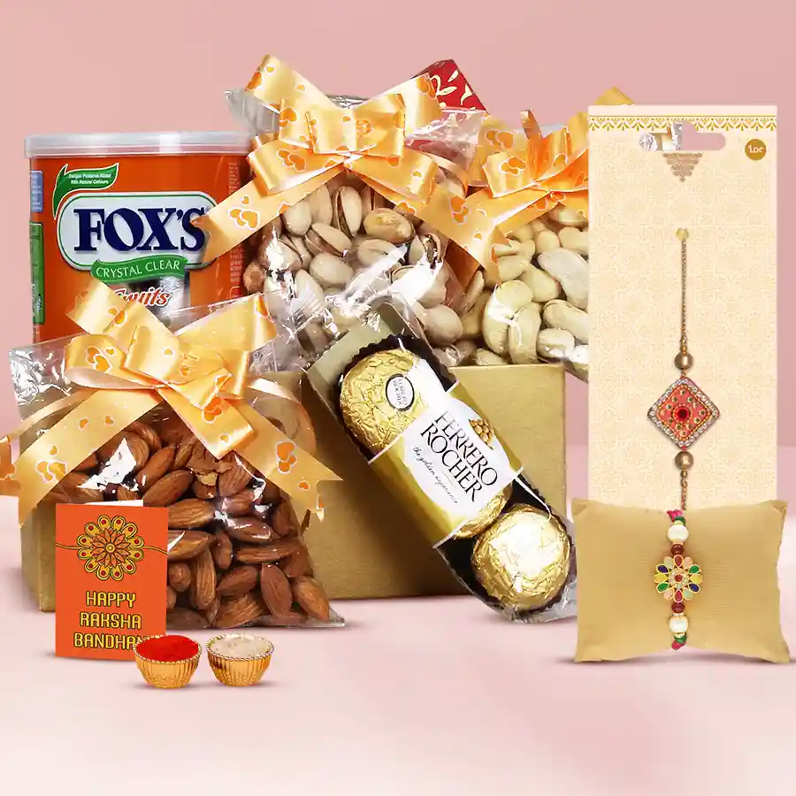 Fancy twin rakhi with chocolates, cashews, almonds, pistachios, and fruity Fox Tin crystals in a beautifully arranged gift hamper