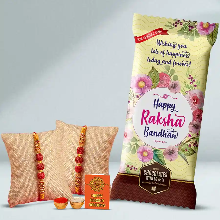 Personalized Chocolate Treat for Raksha Bandhan with customized Cadbury Dairy Milk Fruit & Nut bar, Rudraksha Rakhis, and Rakhi set including Roli, Tika, and Chawal.