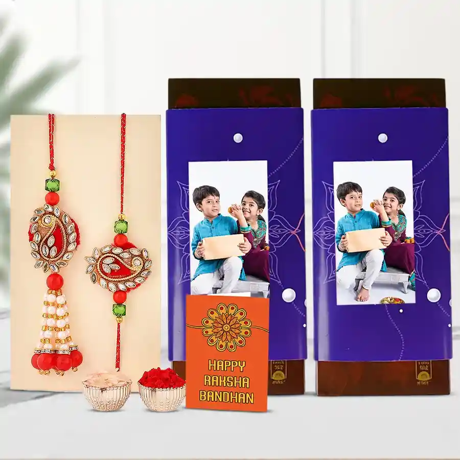 Personalized Raksha Bandhan gift combo featuring customized chocolate bars, Bhaiya Bhabhi Rakhi, and traditional Roli, Tika, and Chawal.