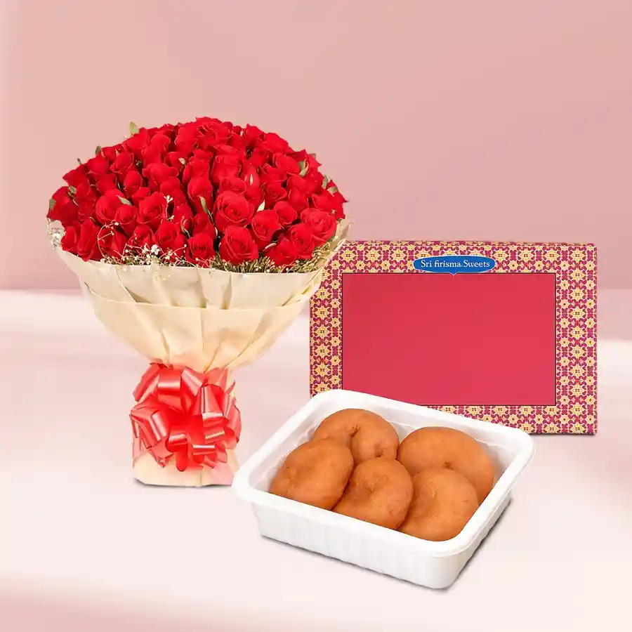 30 red roses wrapped in tissue with a side of Badusha sweets.