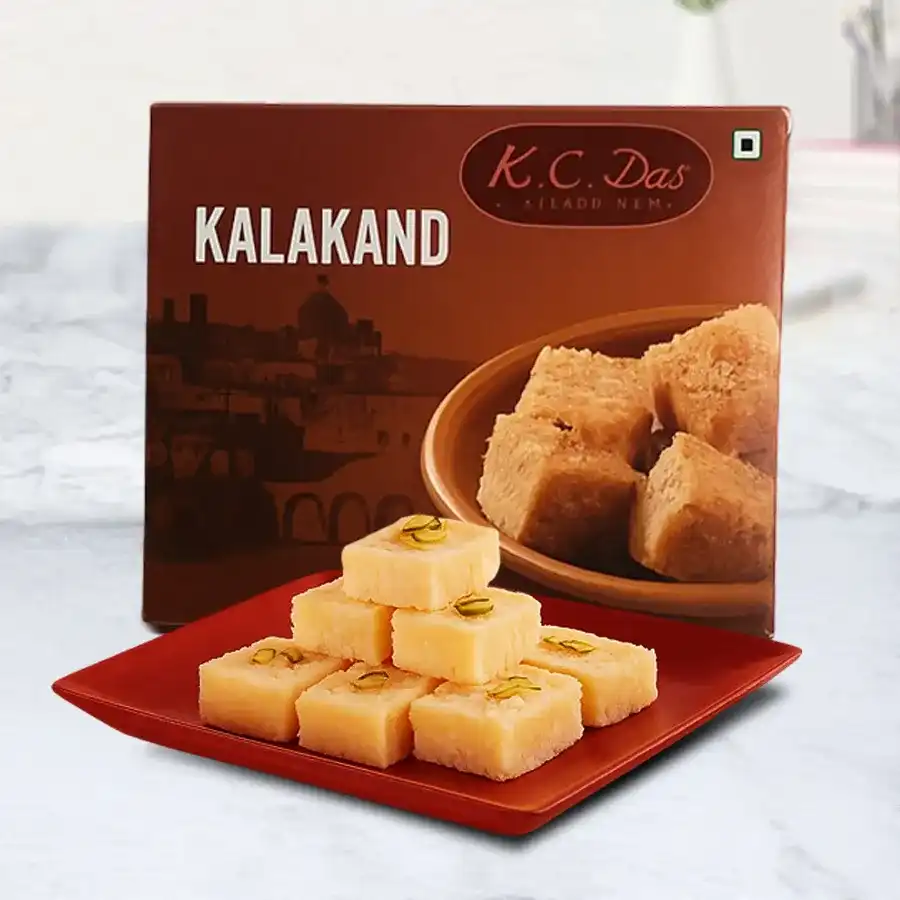 Gift box containing 10 pieces of creamy Kalakand sweets, a traditional Indian delicacy.