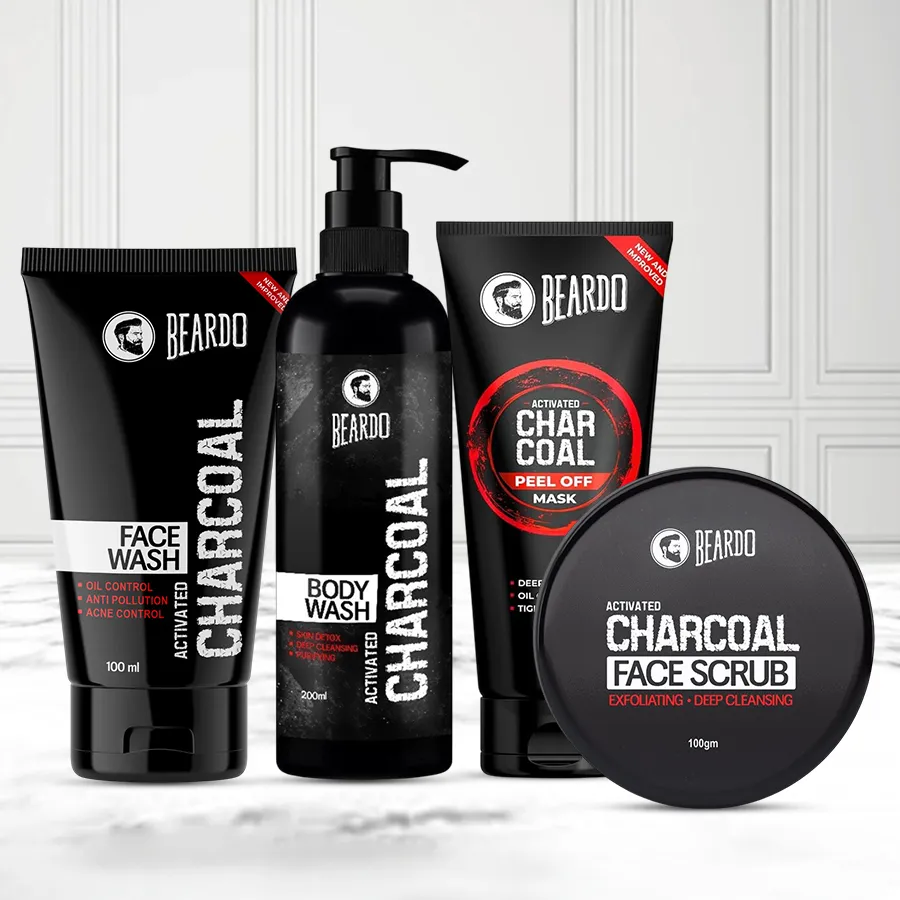 Charcoal Grooming Essentials Combo featuring scrub, face wash, body wash, and peel-off mask for an ultimate cleansing experience.