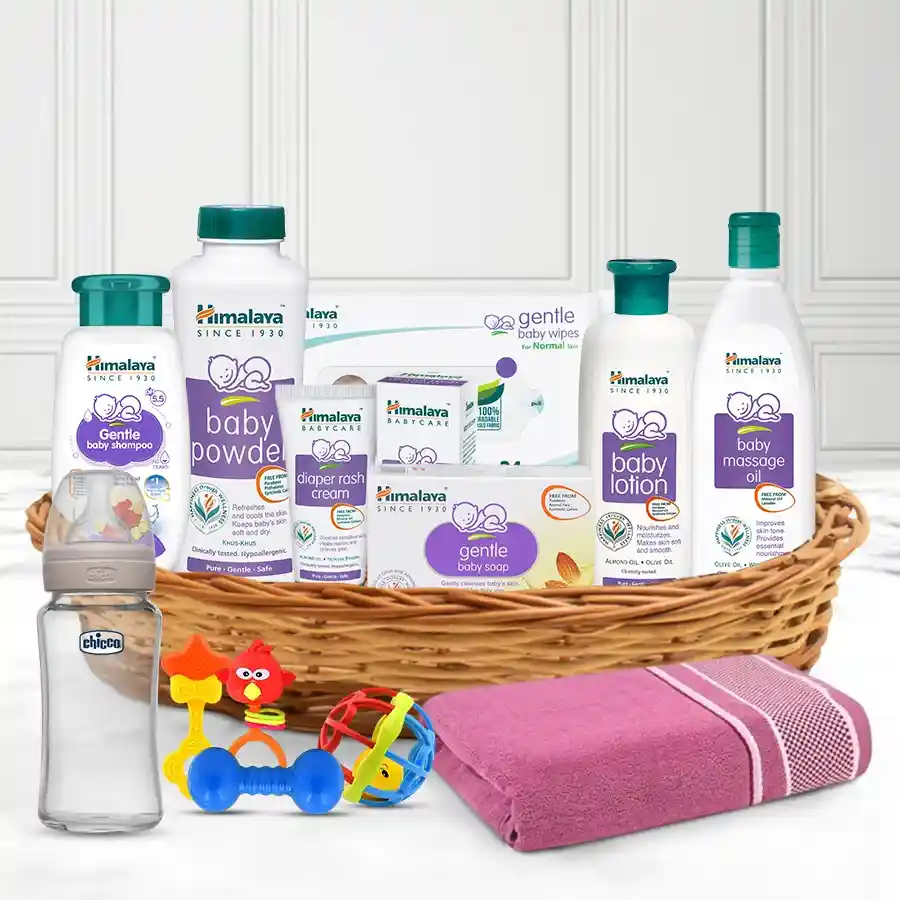 Cherished Himalaya Baby Care Bundle with essential baby products and accessories in a reusable cane basket.